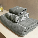 Set of Deia Australian cotton towels from Italic, soft and plush home bed towels displayed in a stylish bathroom setting.