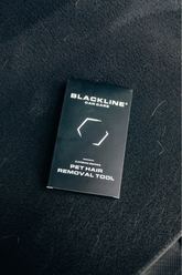Blackline PET Hair Brush by Blackline Car Care with black handle and bristles for removing pet hair from surfaces
