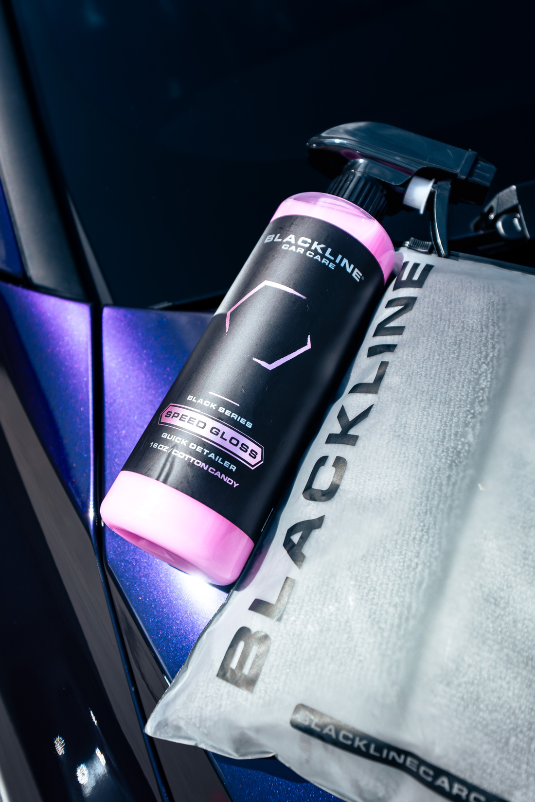 Blackline Car Care BLACKLINE® SPEED GLOSS Quick Detailer showing a shiny, clean car surface with spray bottle and microfiber cloth.