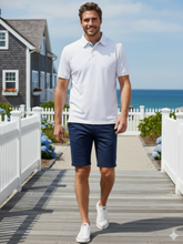 White Water Life Coastline Polo shirt in white, featuring a classic collar and short sleeves, laid flat for display.