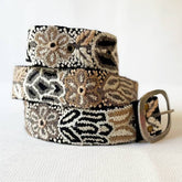 Close-up of Wildroot Artisan embroidered black belt from Fitkitty Culture, showcasing detailed needlework and durable leather strap.