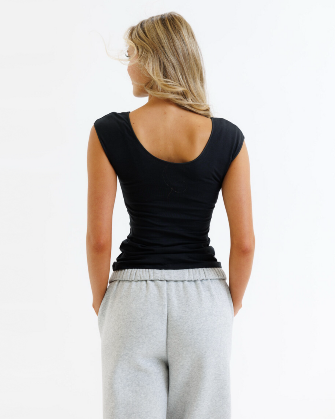 Gray Downeast Wonder Tee featuring a relaxed fit and soft fabric, displayed on a hanger.