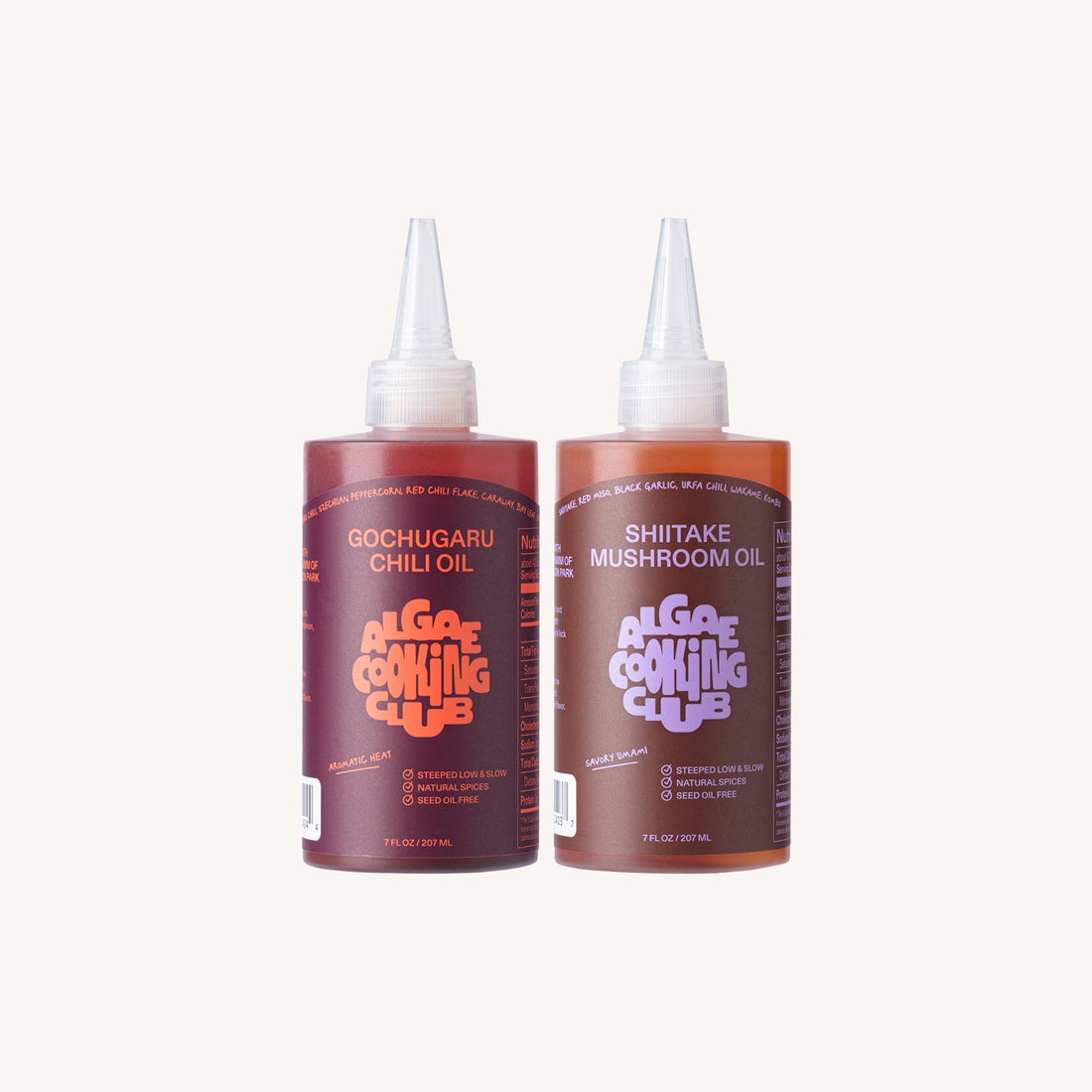 Algae Cooking Club infused oil duo featuring two bottles of flavorful gourmet cooking oils in clear glass bottles.