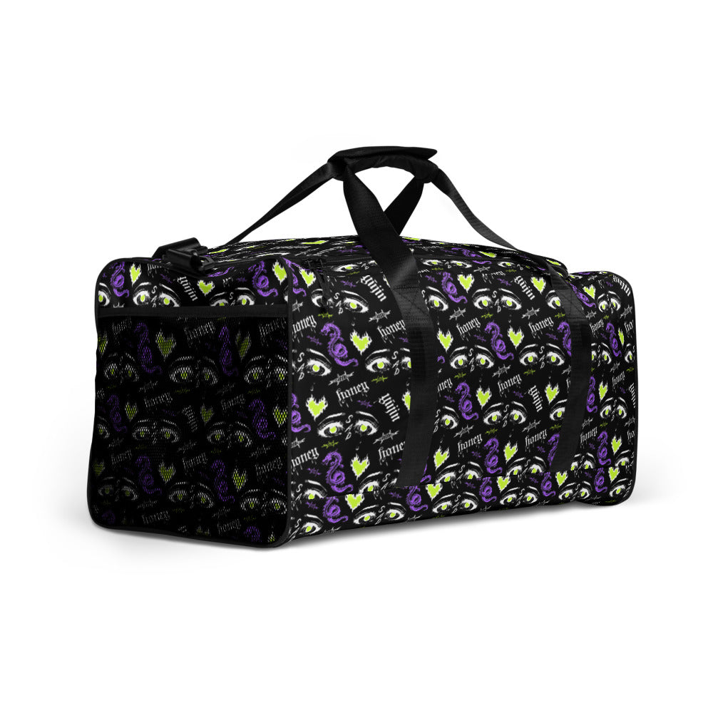 Yūjin Clothing honey-colored duffle bag with sturdy handles and spacious interior for travel or gym use.