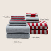 Set of 12 Pietra Australian Cotton Towels by Italic, folded in a bundle, showcasing soft, plush white towels.