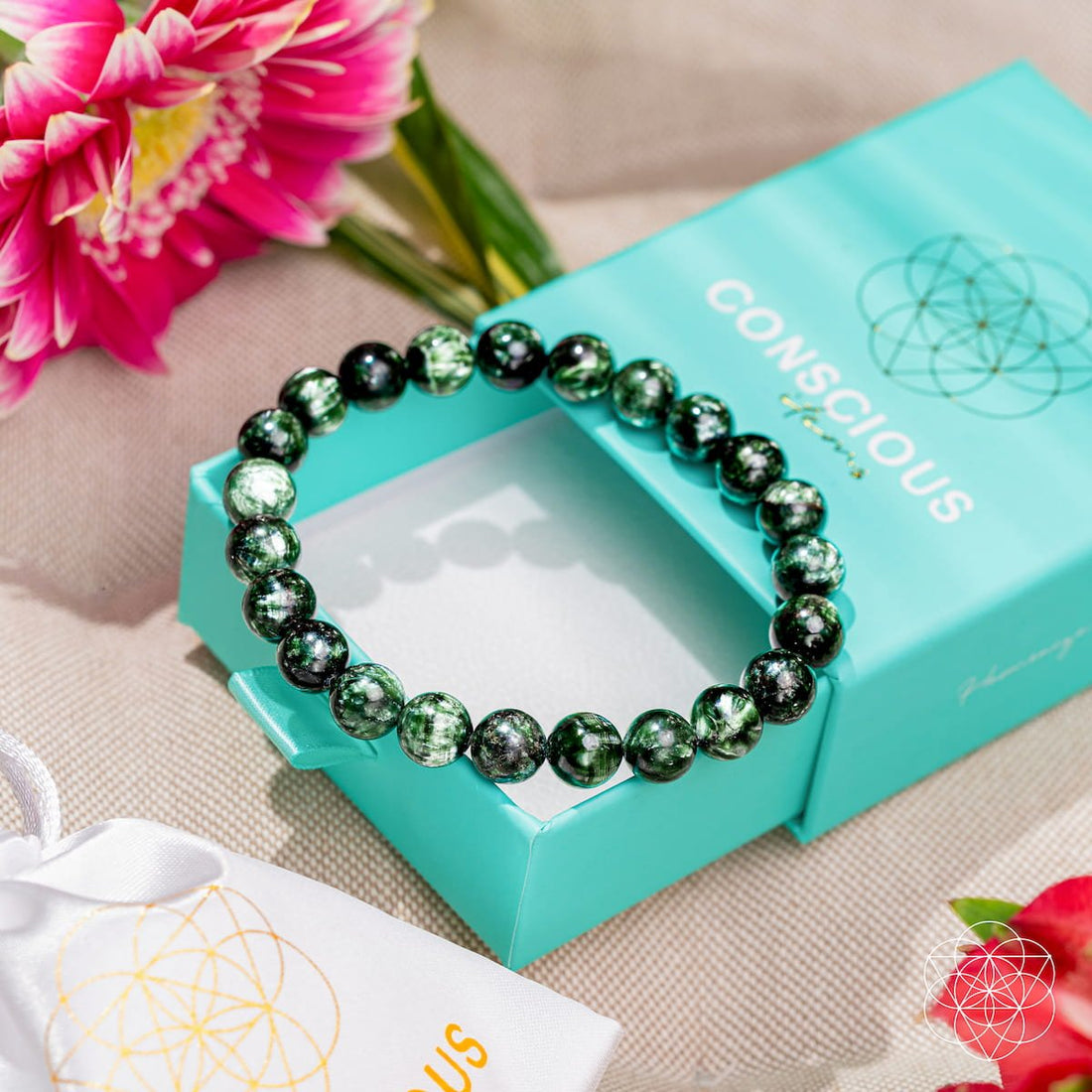 Seraphinite bracelet of transformation by Conscious Items featuring angel energy and rare green gemstone beads.