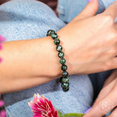 Seraphinite bracelet of transformation from Angel Energy by Conscious Items, featuring deep green and silver-toned gemstone beads.