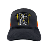 Front view of the Let the Weak Burn trucker hat by Any Means Necessary Clothing featuring a bold design.