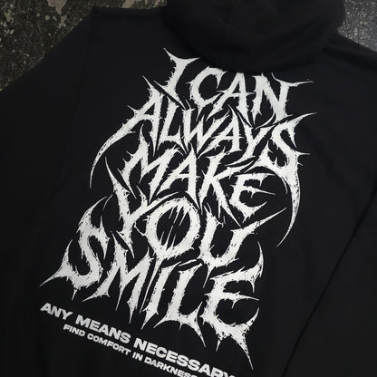 Black Always Smile Pullover Hoodie from Any Means Necessary Clothing, featuring a close-up of the smile graphic on the front.