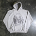 Grey Chapel Pullover Hoodie by Any Means Necessary Clothing, front view showcasing the soft fabric and relaxed fit.