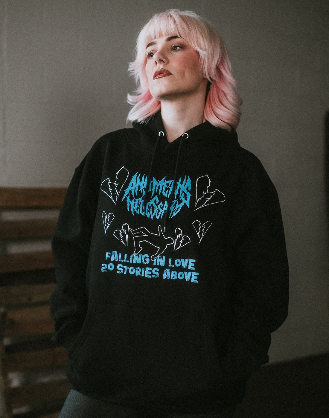 Black Falling in Love hoodie by Any Means Necessary Clothing, featuring a stylish pullover design and comfortable fit.