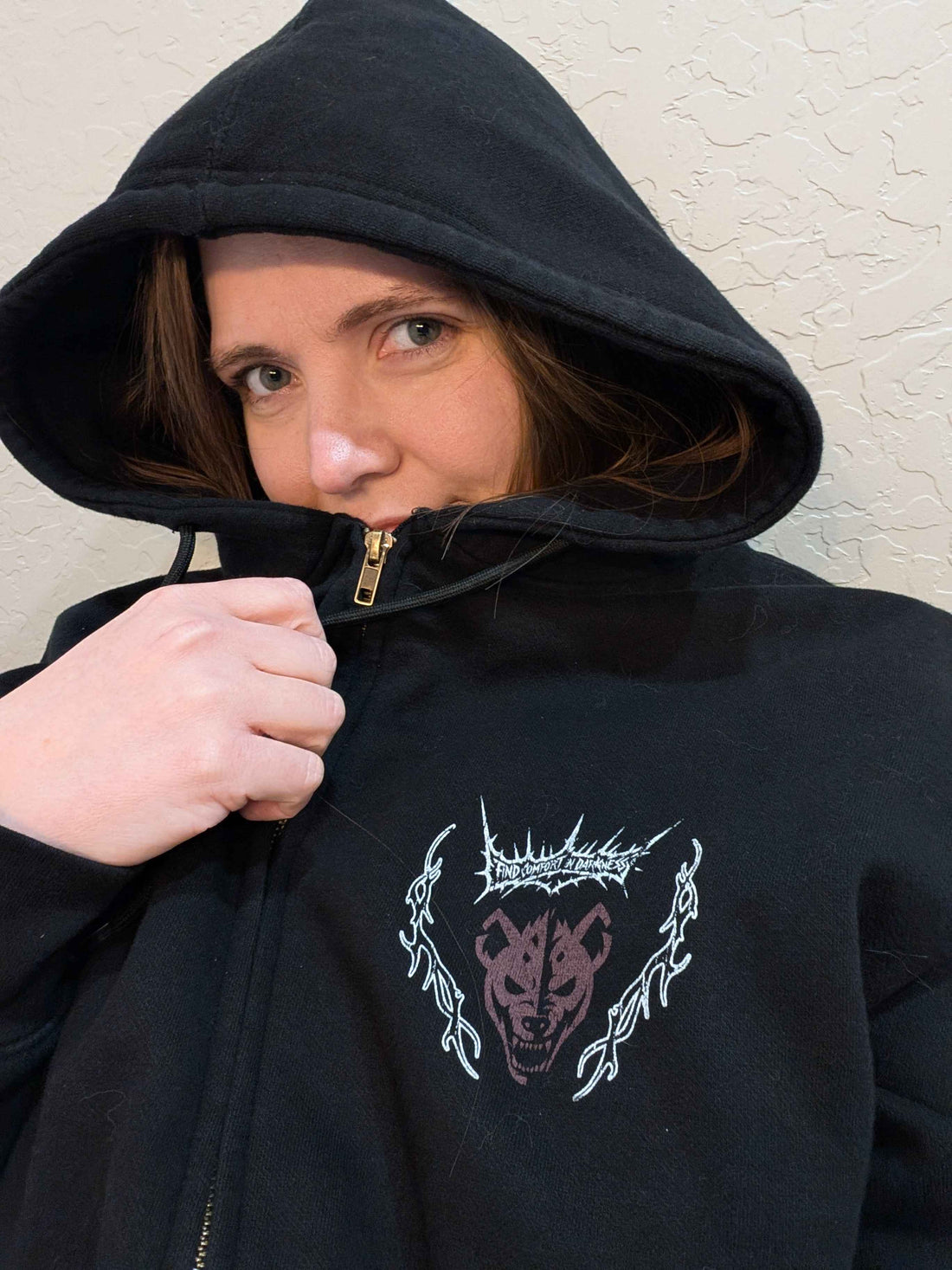 Black Mantra zip-up hoodie from Any Means Necessary Clothing, featuring a front zipper and casual fit.