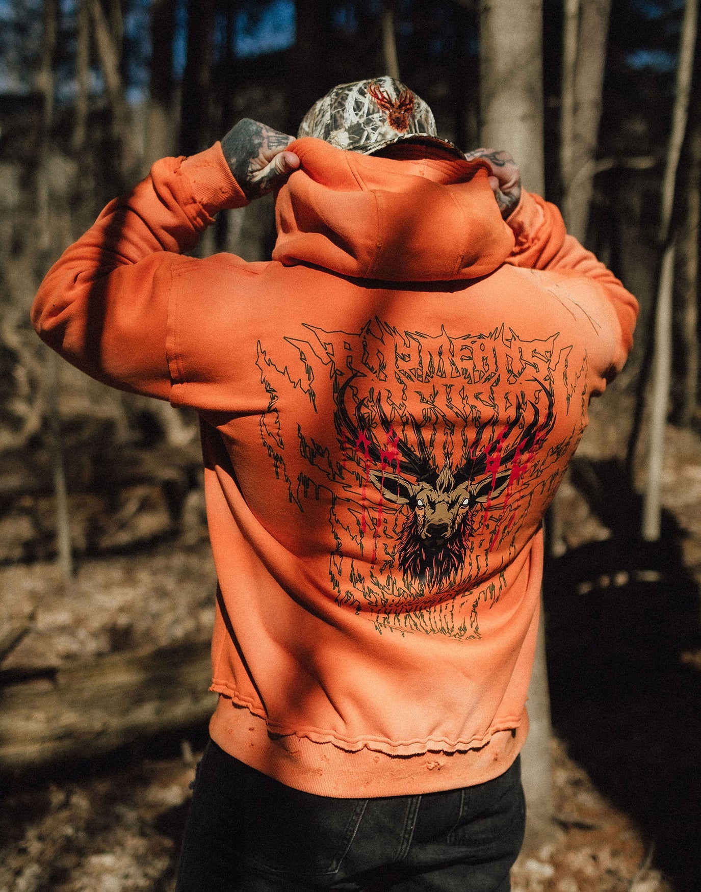 Orange Trophy Pullover Hoodie by Any Means Necessary Clothing, featuring a front graphic design and comfortable fit.