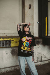 Black Betrayal T-Shirt from Any Means Necessary Clothing, featuring a casual fit and bold graphic design.