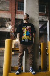 Black Betrayal T-Shirt by Any Means Necessary Clothing, featuring a comfortable fit and bold design displayed on the shirt.