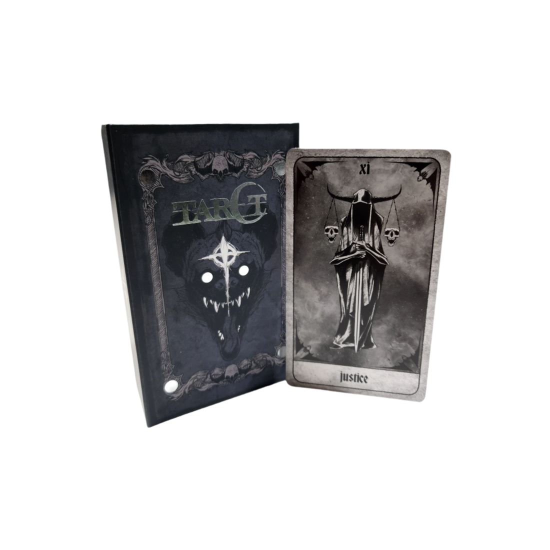A set of tarot cards in a decorative box, featuring intricate designs and artwork from the Any Means Necessary Clothing tarot deck.