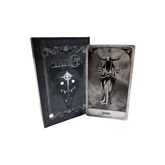 A set of tarot cards in a decorative box, featuring intricate designs and artwork from the Any Means Necessary Clothing tarot deck.