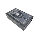 Deck of tarot cards in a decorative box, featuring intricate artwork from the Any Means Necessary Clothing Tarot Deck.