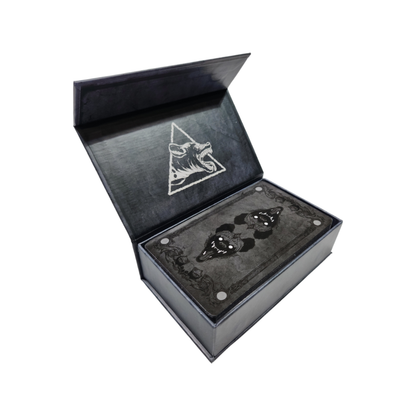 Image of a Tarot Deck in a decorative box, featuring colorful tarot cards from the Any Means Necessary Clothing Tarot Cards set.