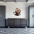 Decorative garage wall decal featuring a playful monkey and football design by Armed American Supply.