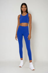 Blue Breathe Easy Cut-Out Back Sports Bra by Fitkitty Culture, made of Lycra® blend, with stylish back cut-out detail for activewear.