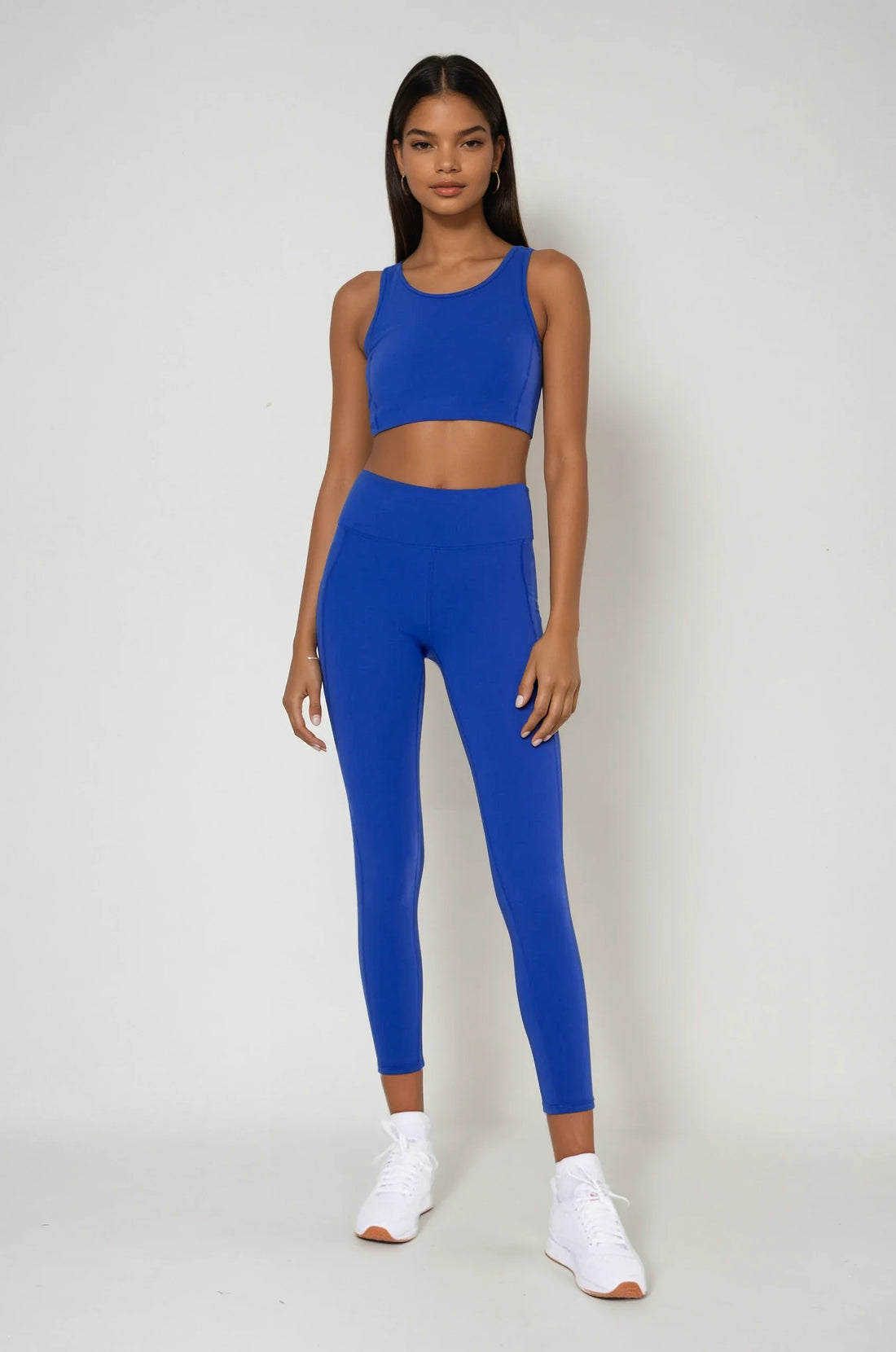 Blue Breathe Easy Cut-Out Back Sports Bra by Fitkitty Culture, made from Lycra® blend, shown with cut-out back design for activewear.