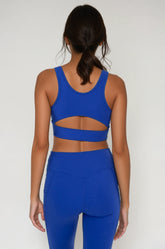 Blue Breathe Easy Cut-Out Back Sports Bra by Fitkitty Culture, made of Lycra® blend, designed for activewear and yoga.