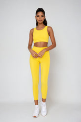 Yellow Breathe Easy cut-out back sports bra by Fitkitty Culture, made of Lycra® blend, suitable for yoga and active wear.