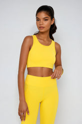 Yellow Breathe Easy Cut-Out Back Sports Bra by Fitkitty Culture, made of Lycra® blend, featuring a stylish back cut-out design.