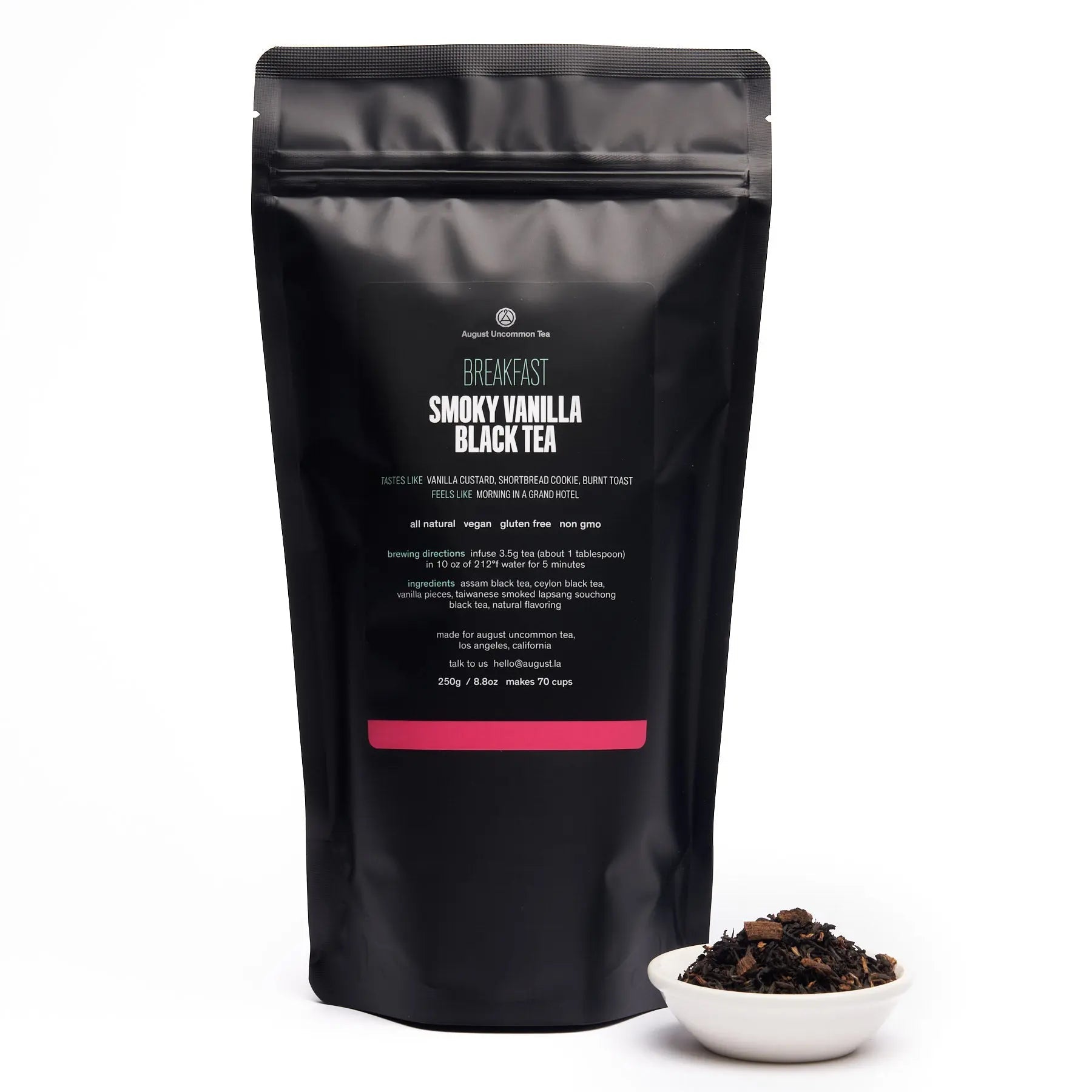 Smoky vanilla black tea in a 70-cup bag from August Uncommon Tea, with dried tea leaves and vanilla beans.