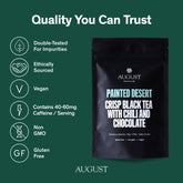 Cup of Painted Desert Chocolate Chili Black Tea by August Uncommon Tea, showcasing dark brewed tea in a clear glass mug.