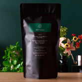 Single estate Nepalese Black Tea from August Uncommon Tea, featuring rare gold leaves and rich black tea leaves in a large bag.