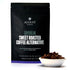 Herbal tea bag labeled Daybreak Sweet Roasted Coffee Alternative by August Uncommon Tea, caffeine-free beverage for tea lovers.