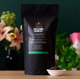 Sweet Lemon Oolong Green Tea bag from August Uncommon Tea, showcasing a vibrant tea package with lemon and green tea leaves.