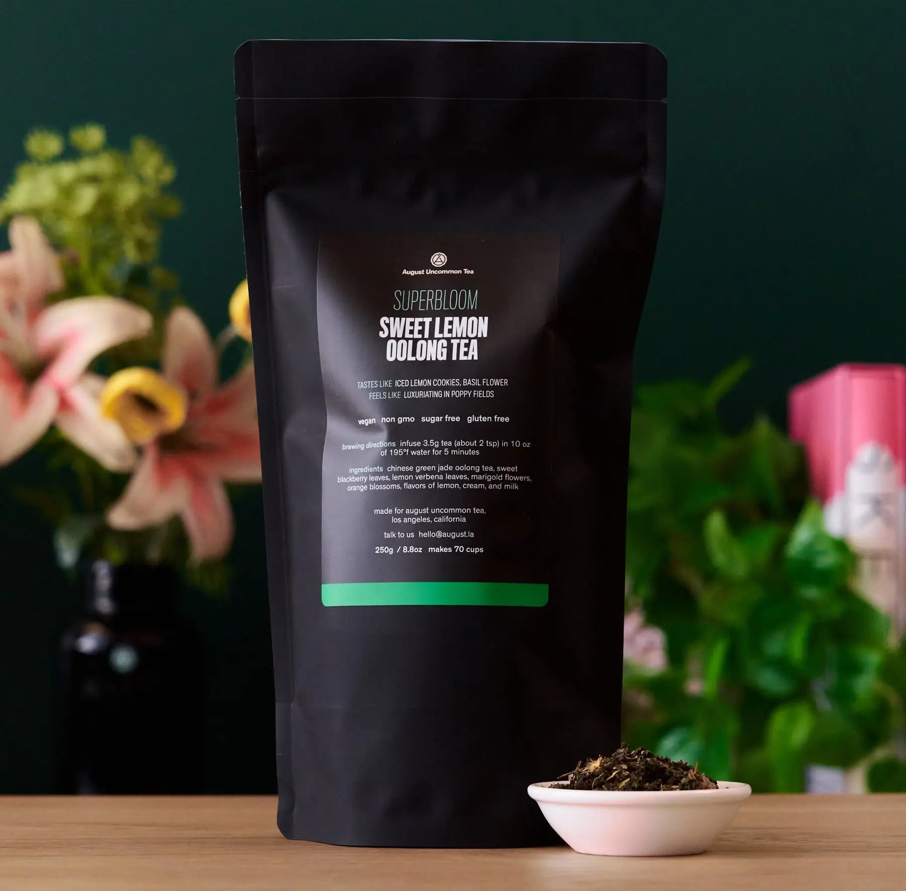 Sweet Lemon Oolong Green Tea bag from August Uncommon Tea, showcasing a vibrant tea package with lemon and green tea leaves.