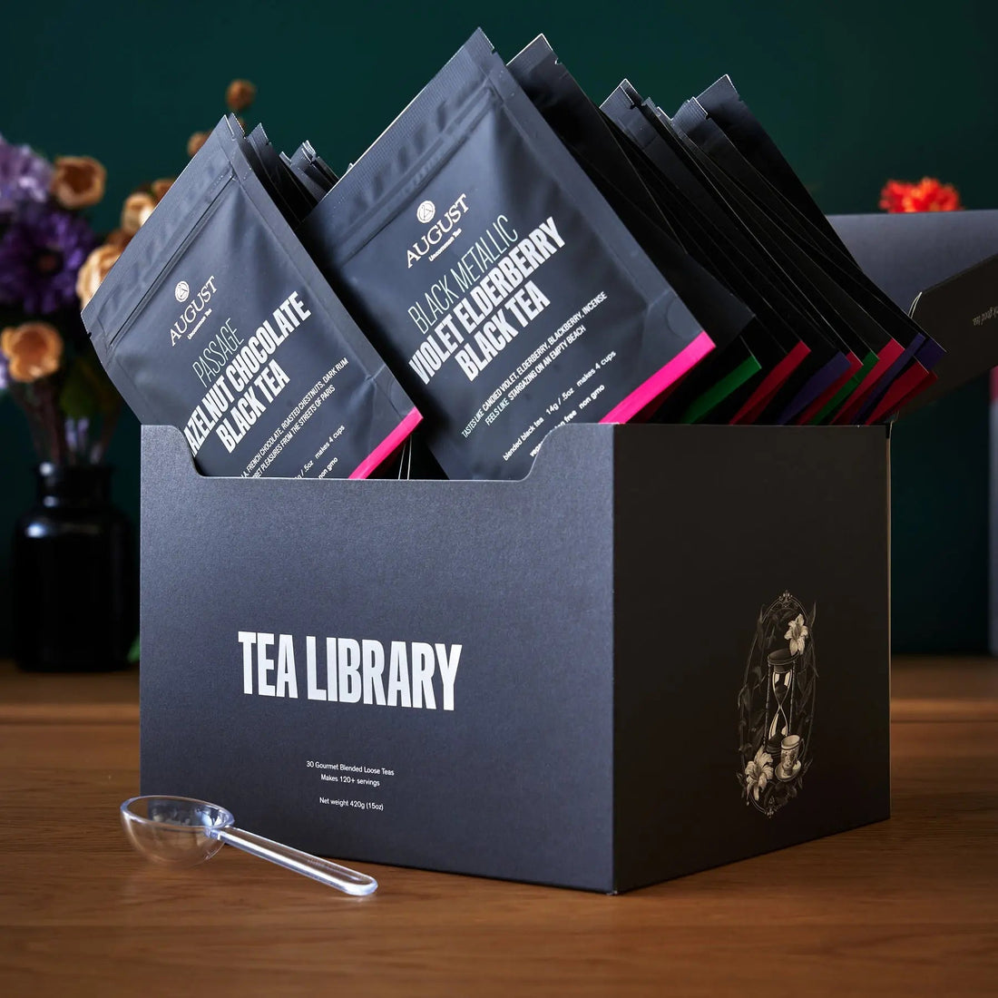 August Uncommon Tea Deluxe 30 Tea Sampler featuring a variety of loose leaf teas in a elegant packaging.