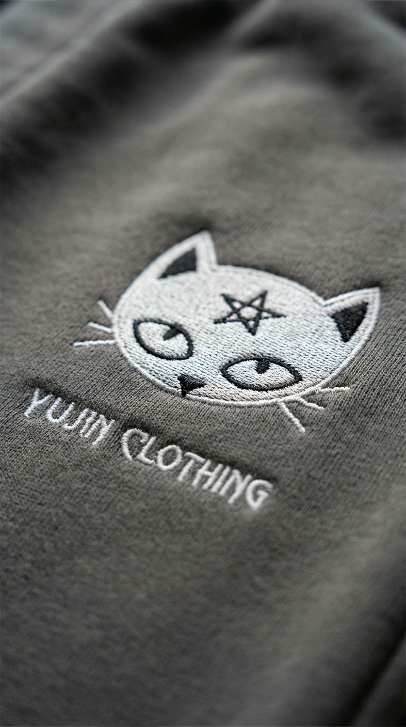 Yūjin Clothing Devil Cat sweatpants featuring a playful devil cat graphic on soft, comfortable fabric for casual wear.