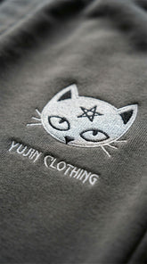 Yūjin Clothing Devil Cat sweatpants featuring a playful devil cat graphic on soft, comfortable fabric for casual wear.