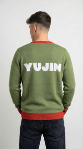 Yūjin Clothing Christmas Hater Cat sweatshirt featuring a festive design with a cat illustration and holiday-themed graphics.