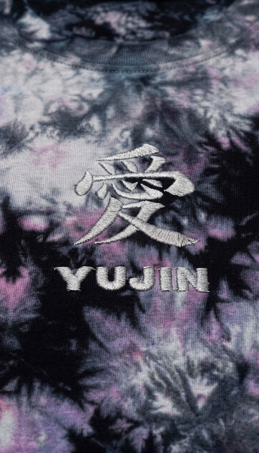 Japanese love tie-dye T-shirt by Yūjin Clothing showing vibrant, colorful tie-dye fabric with a relaxed fit and short sleeves.