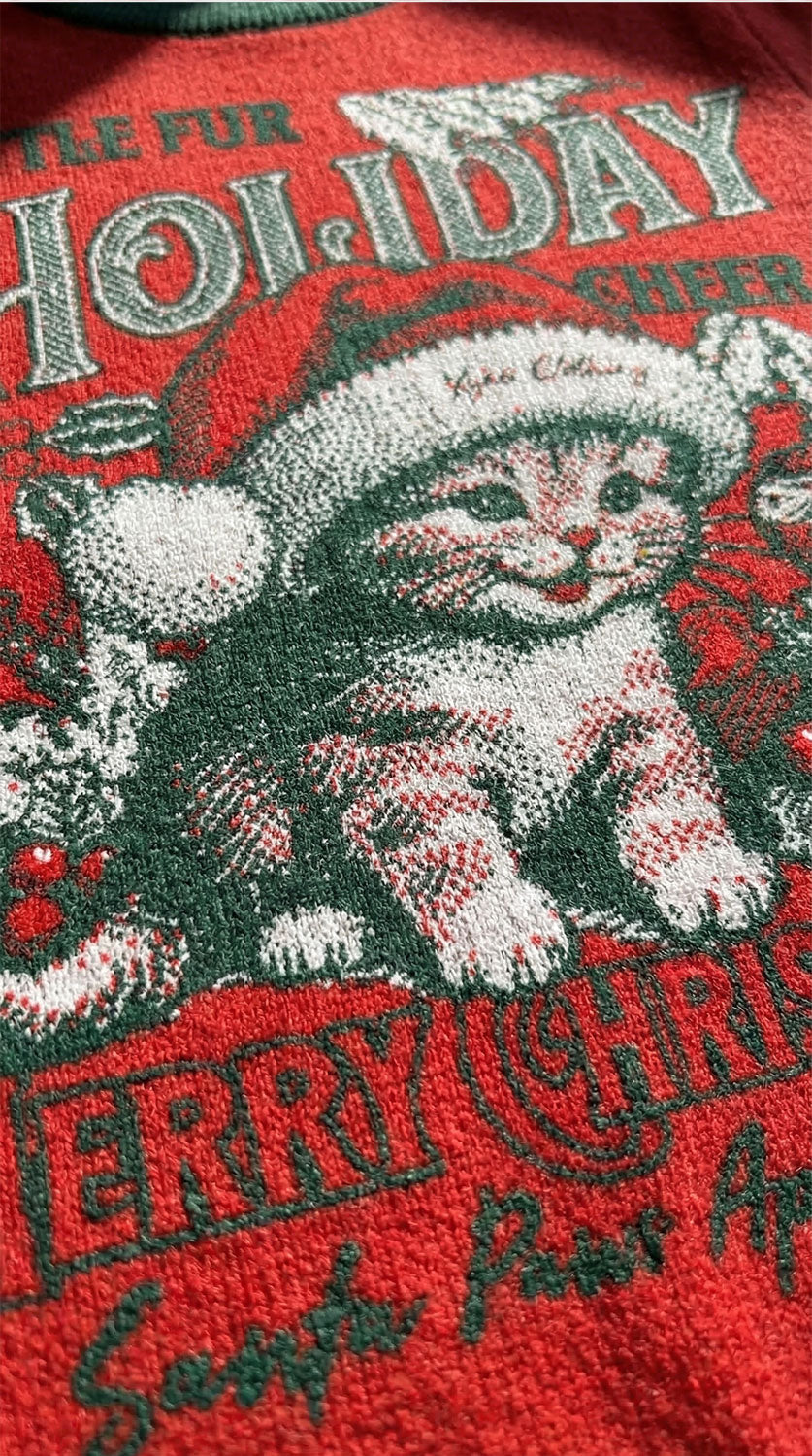 Yūjin Clothing holiday cheer cat sweatshirt featuring festive holiday design and cozy fabric, ideal for winter wear.