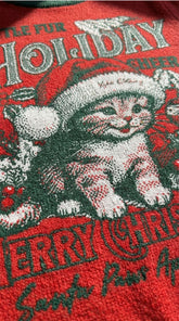Yūjin Clothing holiday cheer cat sweatshirt featuring festive holiday design and cozy fabric, ideal for winter wear.