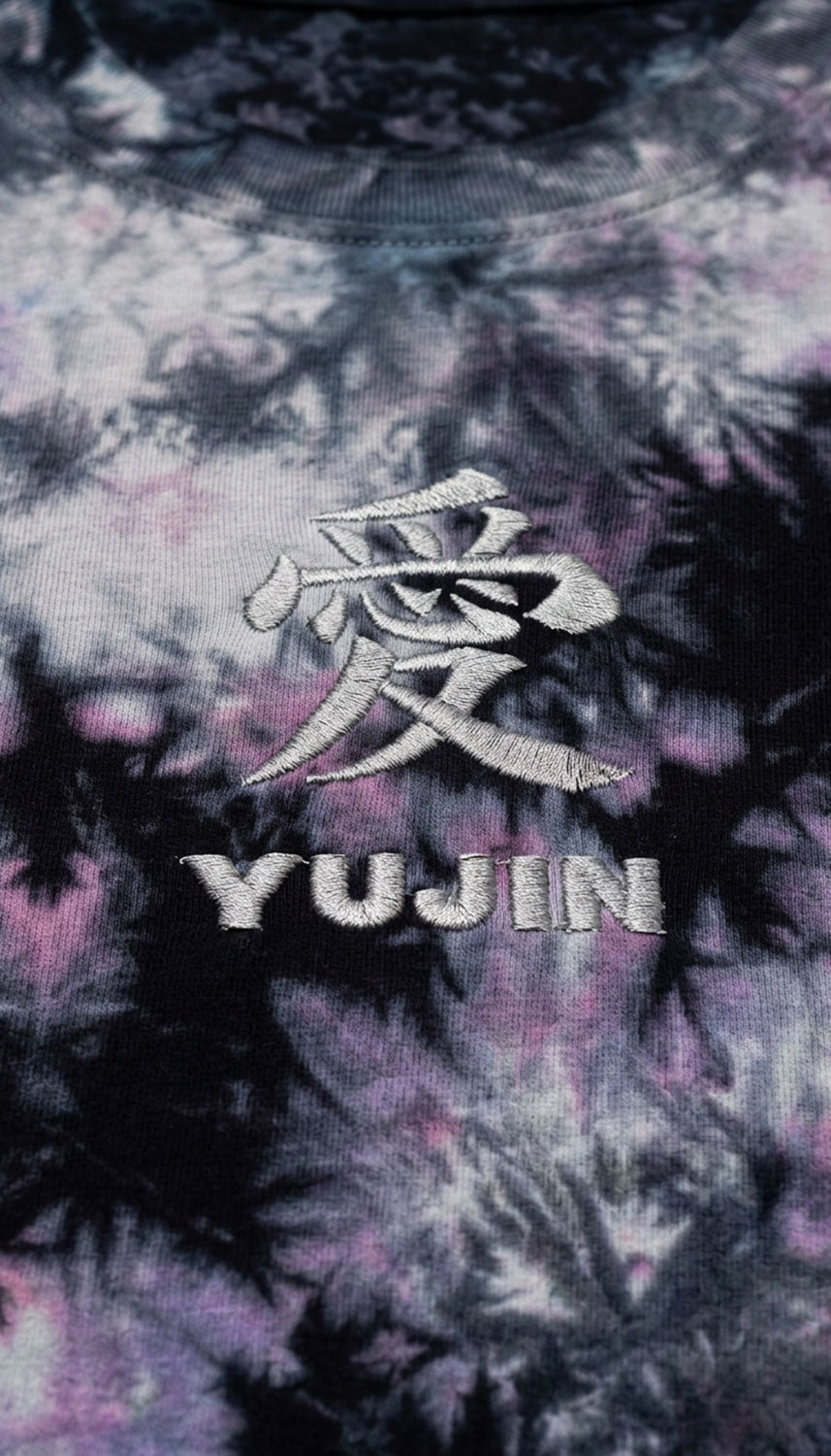 Yūjin Clothing Amor tie-dye T-shirt featuring vibrant, colorful patterns and a casual fit, displayed on a plain background.