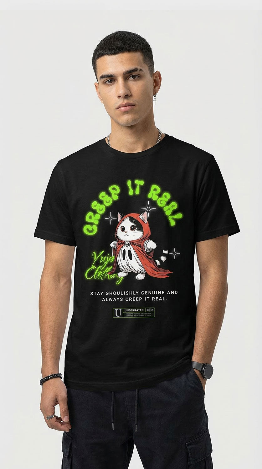 Yūjin Clothing Creep It Real cat T-shirt featuring a spooky cat graphic on a black cotton shirt.