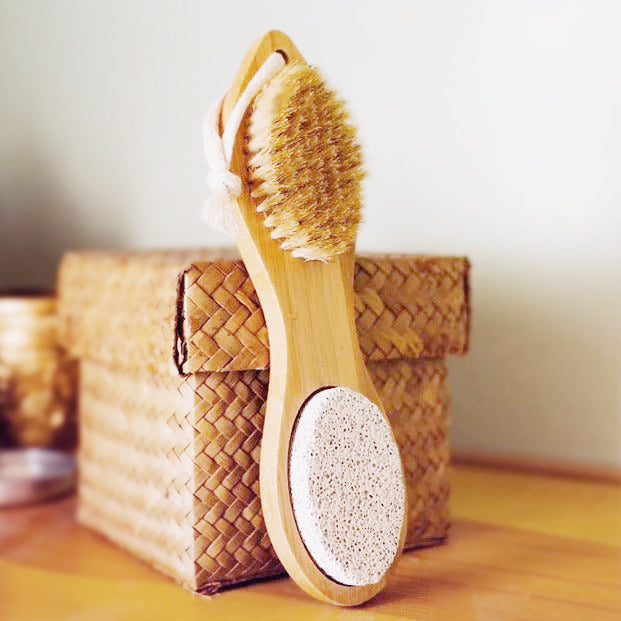 Bamboo exfoliating foot pedicure tool from Pretty Farm Girl, natural bamboo handle with foot scrubber surface for foot care.