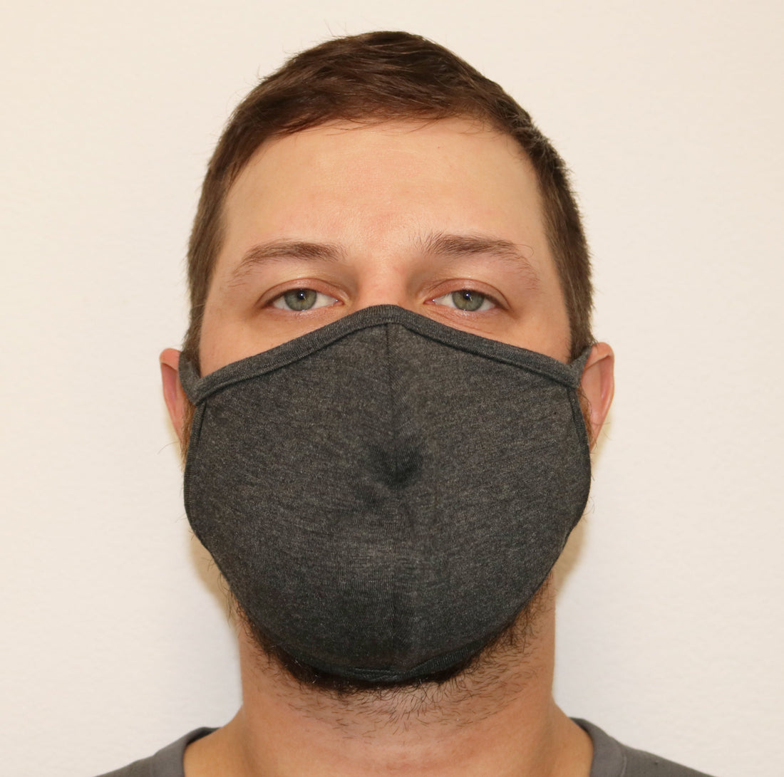 Large bamboo face mask by Spun Bamboo with triple-layer design, natural color, silky soft fabric, and ultra-comfortable fit.