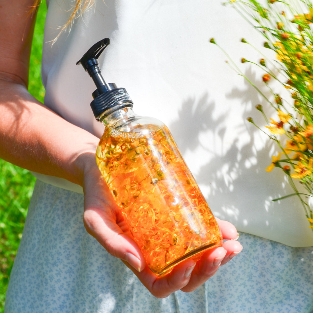 Bare Flower fragrance-free body oil by Pretty Farm Girl, showing a sleek bottle of health and beauty skincare product.