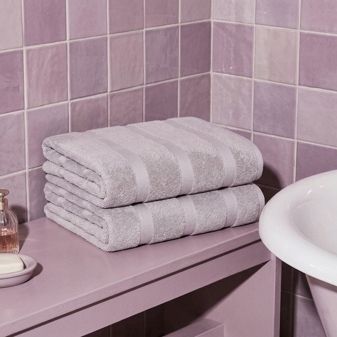 Italic Capri Australian Cotton Bath Towel displayed on a hook, showcasing its soft, plush texture and high-quality cotton fabric.
