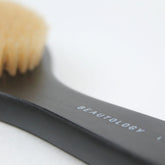 BEAUTOLOGY LAB lymphatic dry brush with wooden handle and bristles, designed for body lymphatic drainage and skin exfoliation.