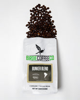 Ground Birdie Coffee Company Bunker Blend Latin American coffee beans in a bag, showcasing rich, dark roasted grounds.